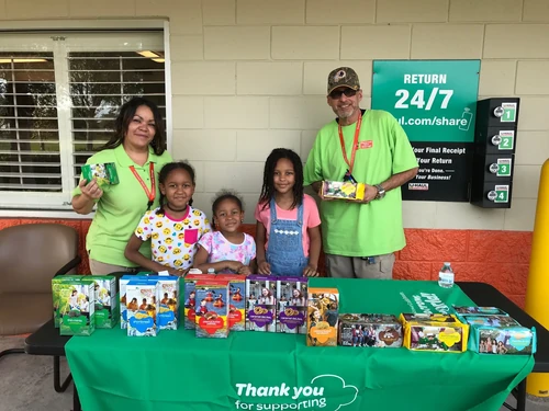 Personal Mini Storage employees helping at a Girl Scouts Cookie sale