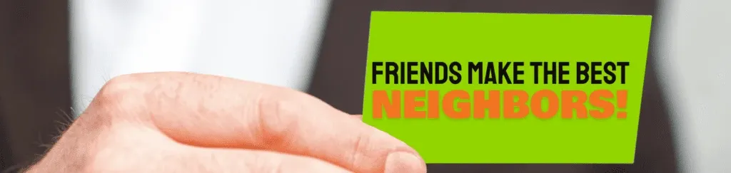 A hand holding a bright green card that reads 'Friends Make the Best Neighbors!