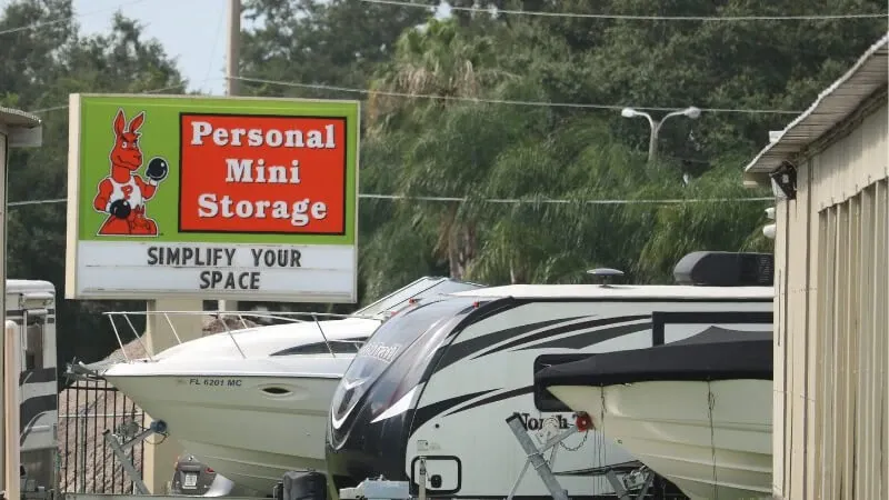 personal mini storage sign next to rvs and boats